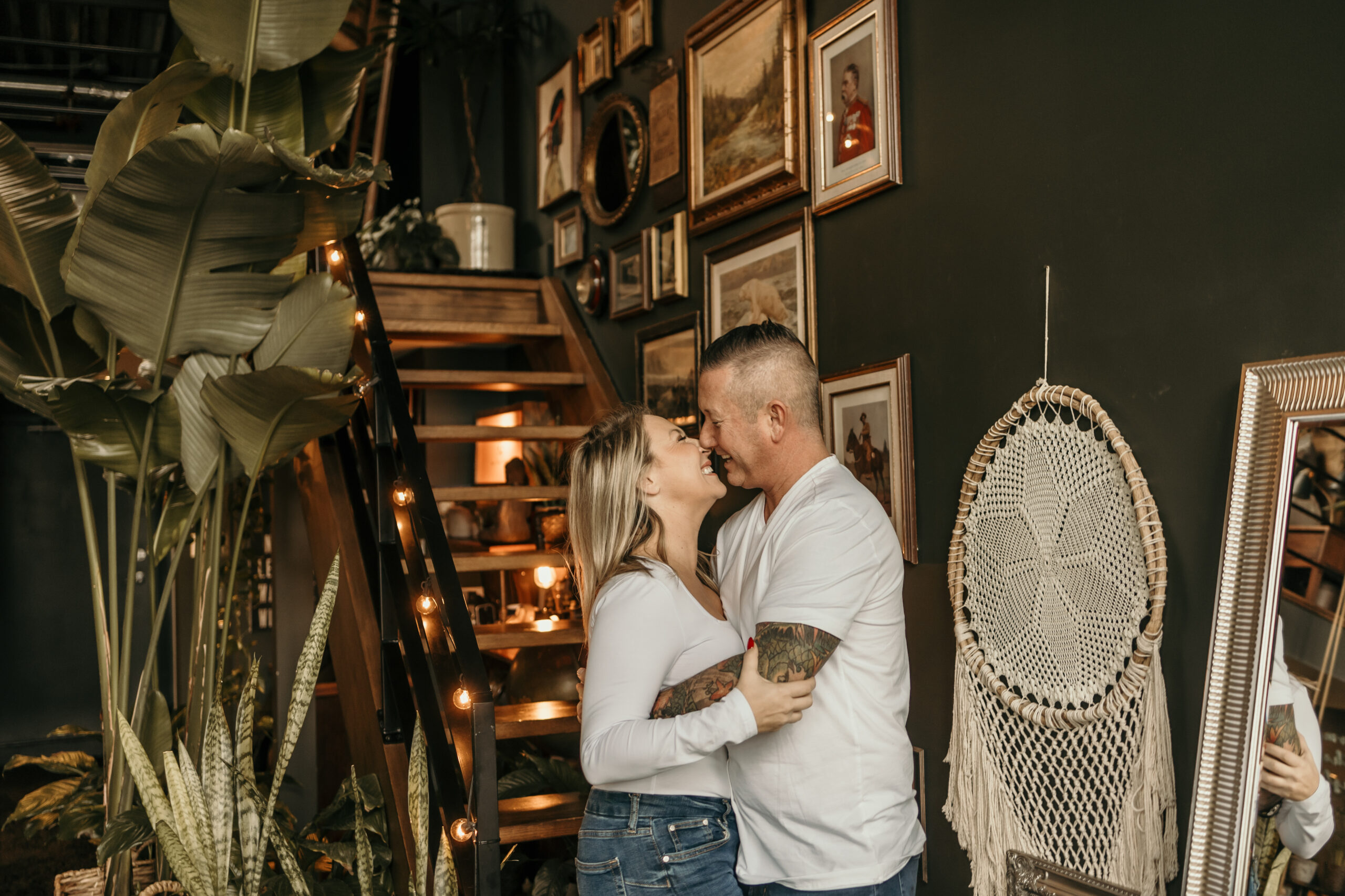 A couple embraces in Loft Garden Oasis, a unique and stylish photography studio in Vancouver, BC.